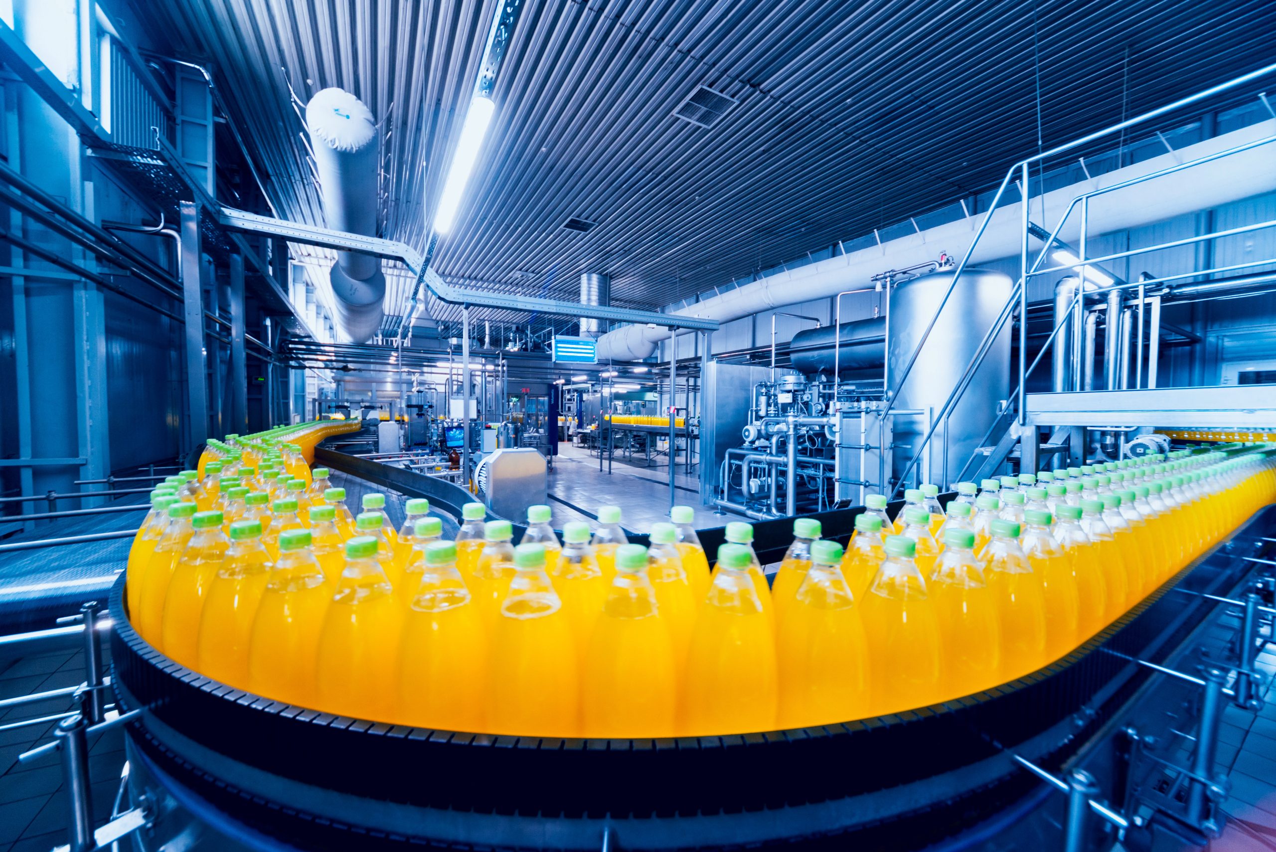 Beverage factory interior. Conveyor with bottles for juice or water. Equipments